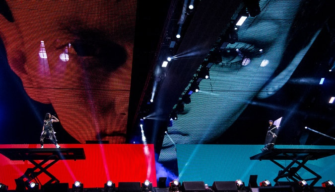 Performers on hydraulic lifts in The Monster Tour 2014.